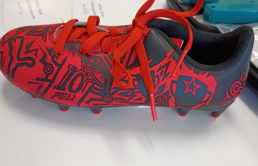 Puma Red and Black Soccer Cleats with Graphic Design